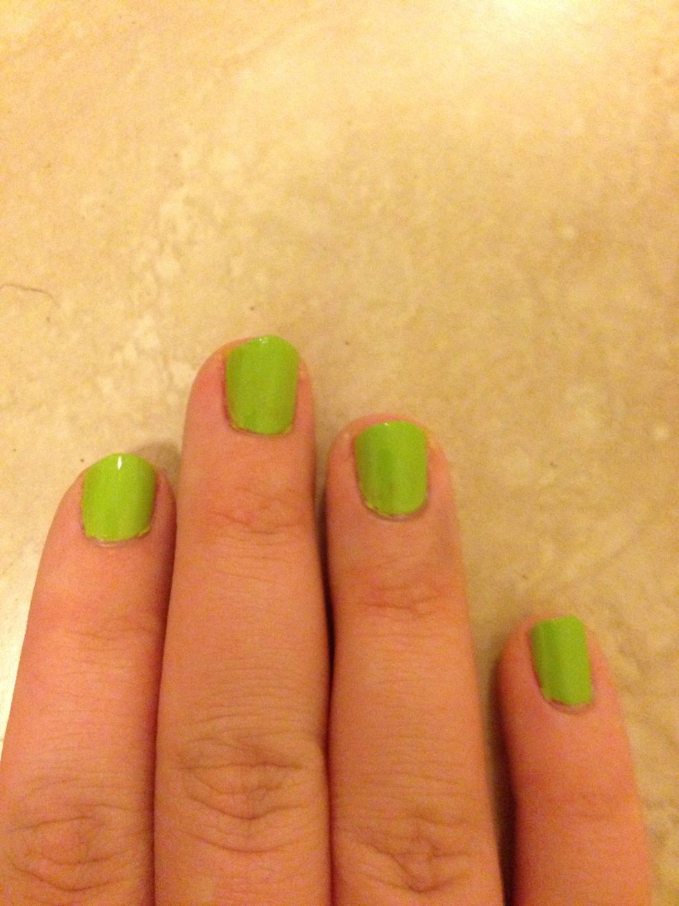 Paint your nails 2 coats of a light green polish.