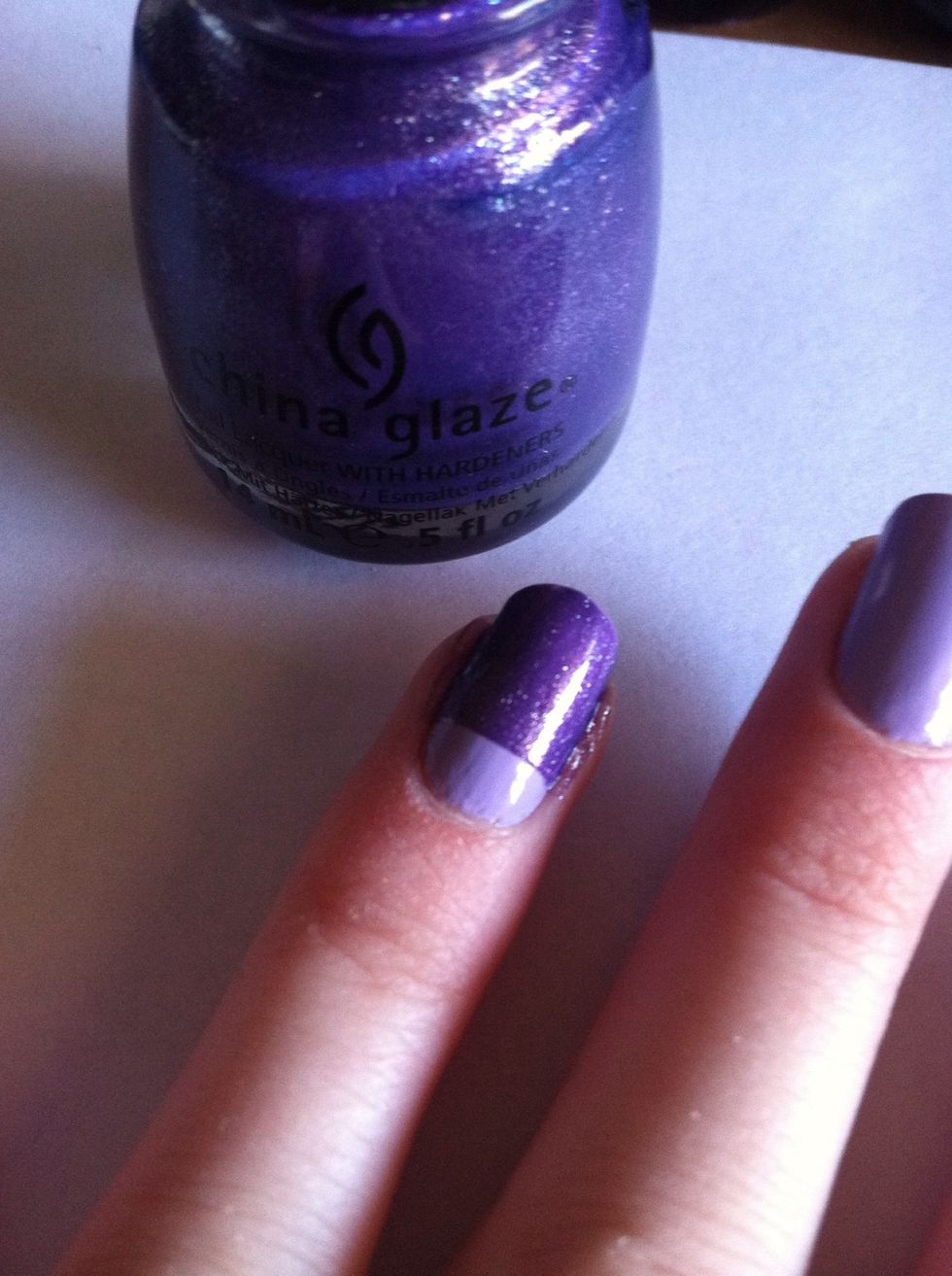 Paint your nails a darker purple and gently peel off the tape.