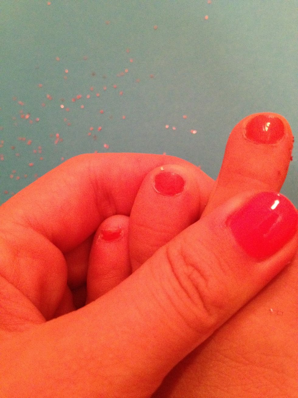 Paint your nails around the same color the sparkles are.You don't have to have to base coat,you may just paint your toenails,then put on the sparkles.But I painted mine already, so I put base coat on.