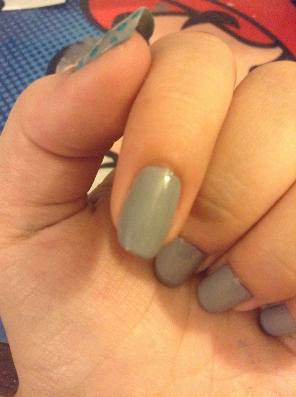 Paint your nails either white, if you're using neon colors (to make them brighter) or the lightest of the colors you're using.