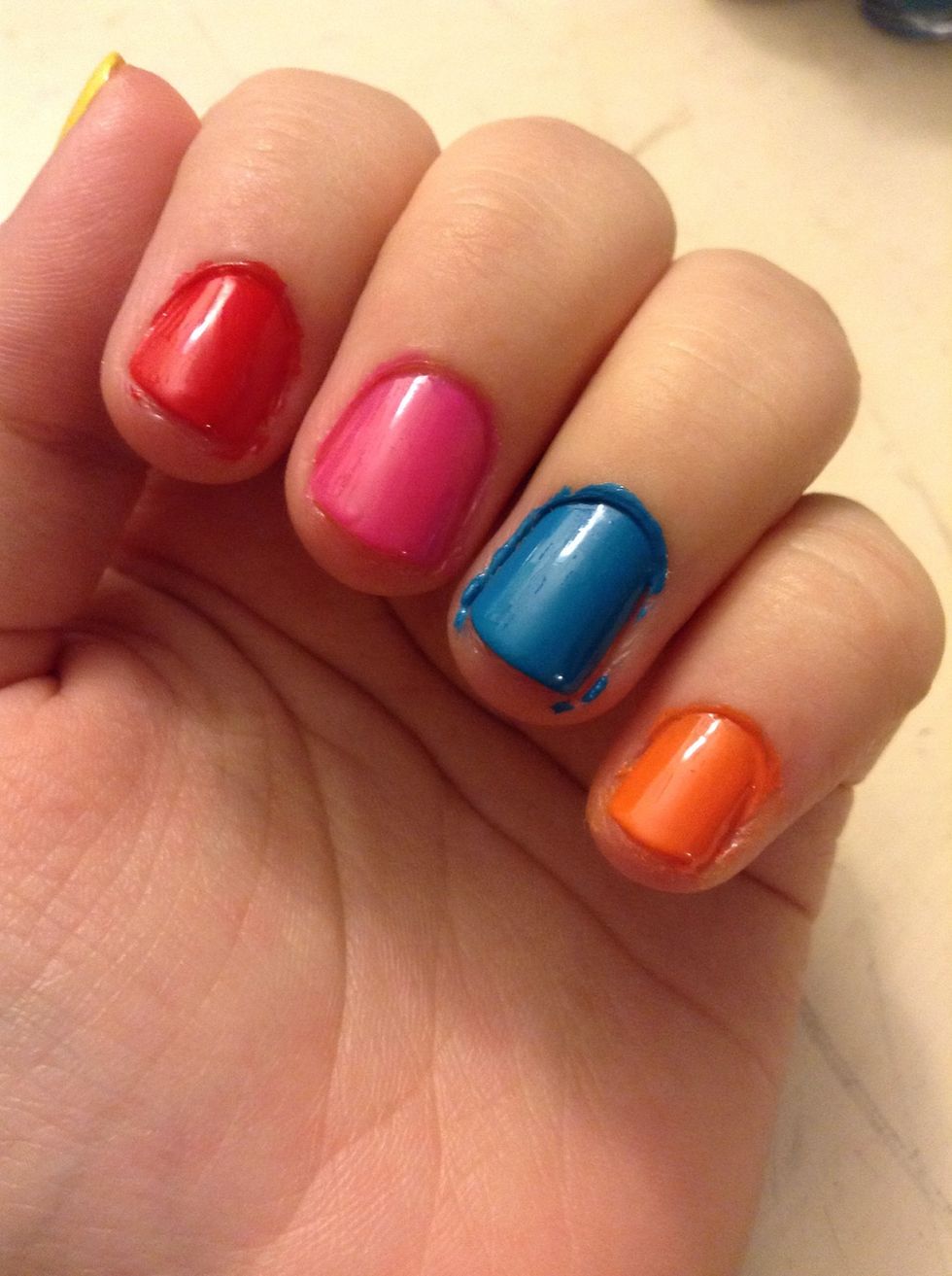 Paint your nails red, pink, blue (a bright blue), and orange.