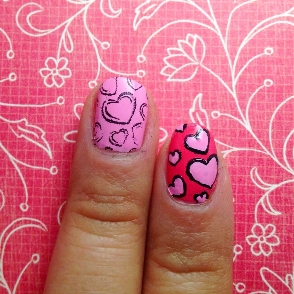 Paint your nails with a base. Transfer the heart image from bundle monster on to your nails.