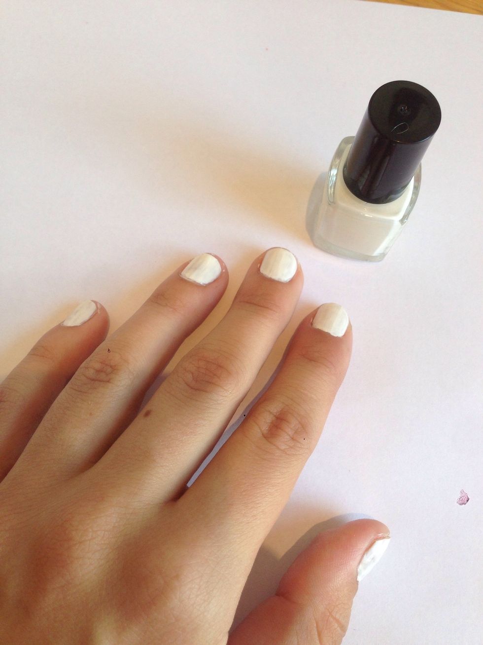 Paint your nails with the base coat.