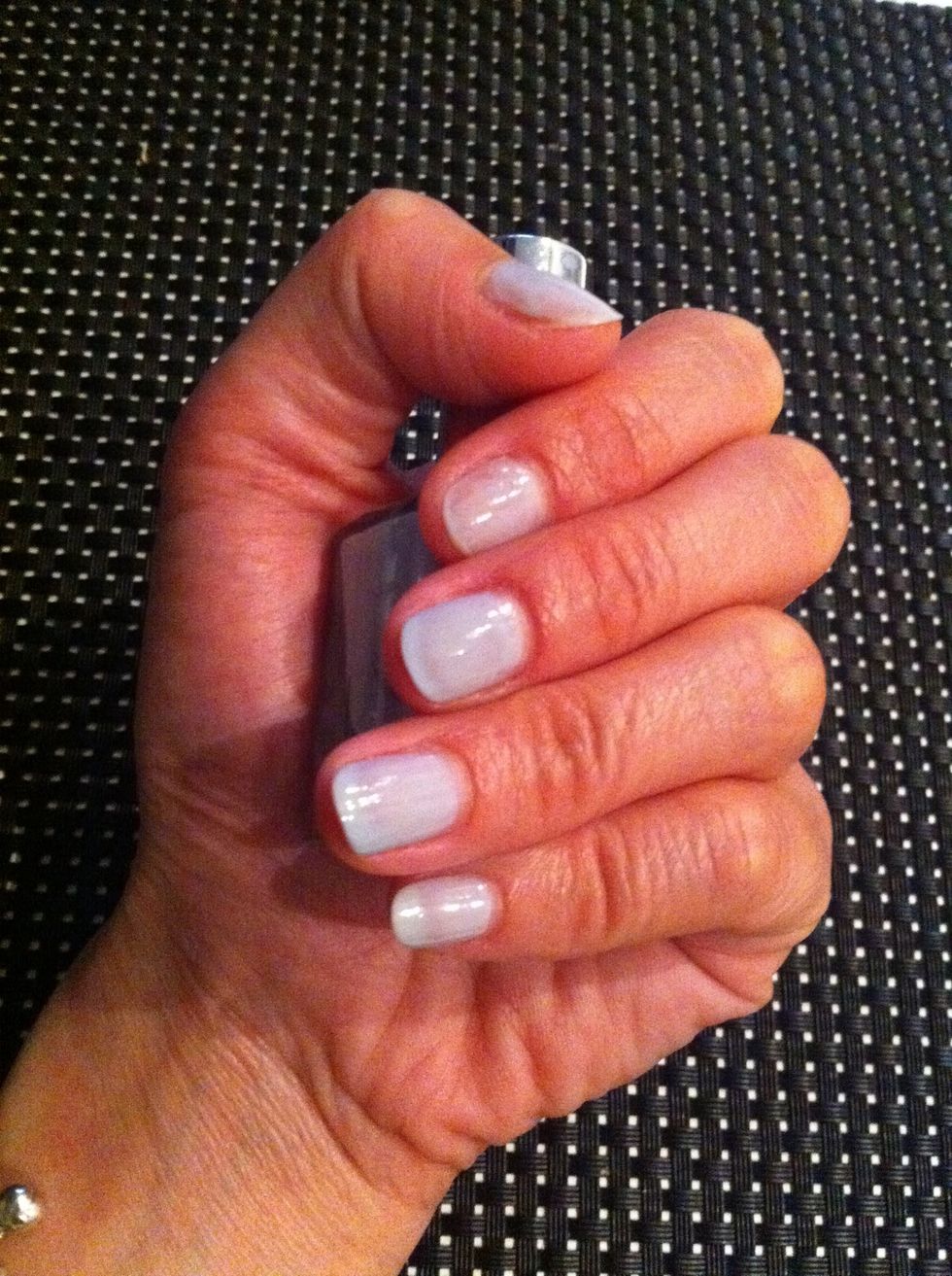 Paint your nails with the white nail polish. My white colour has a grey shade so its not totally (snow)white.