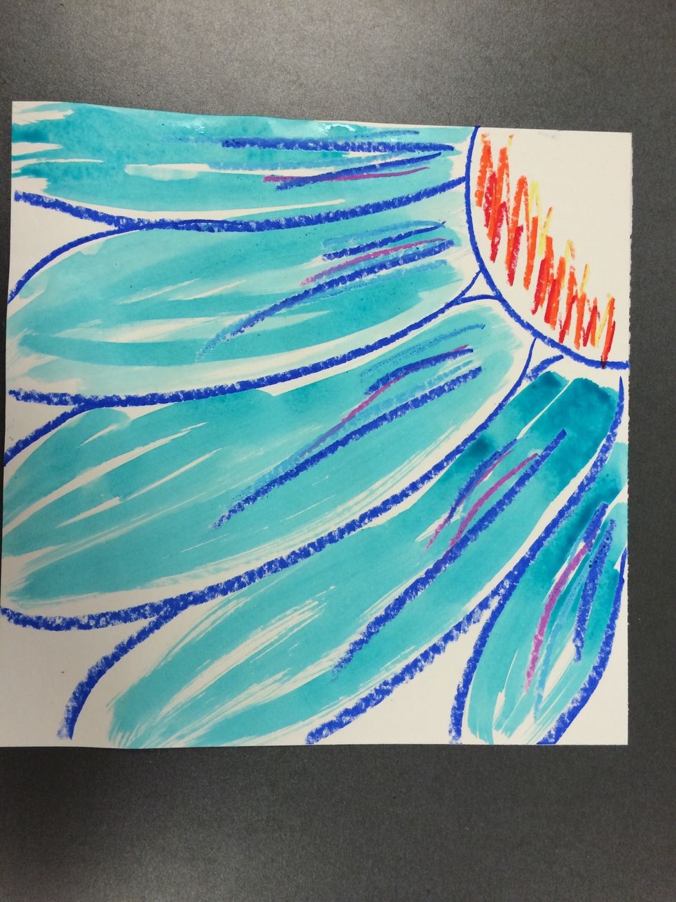 Paint your petals in the color of your choice. Paint right over the oil pastel. It will not cover it up. Leave some streaks of white as you paint.