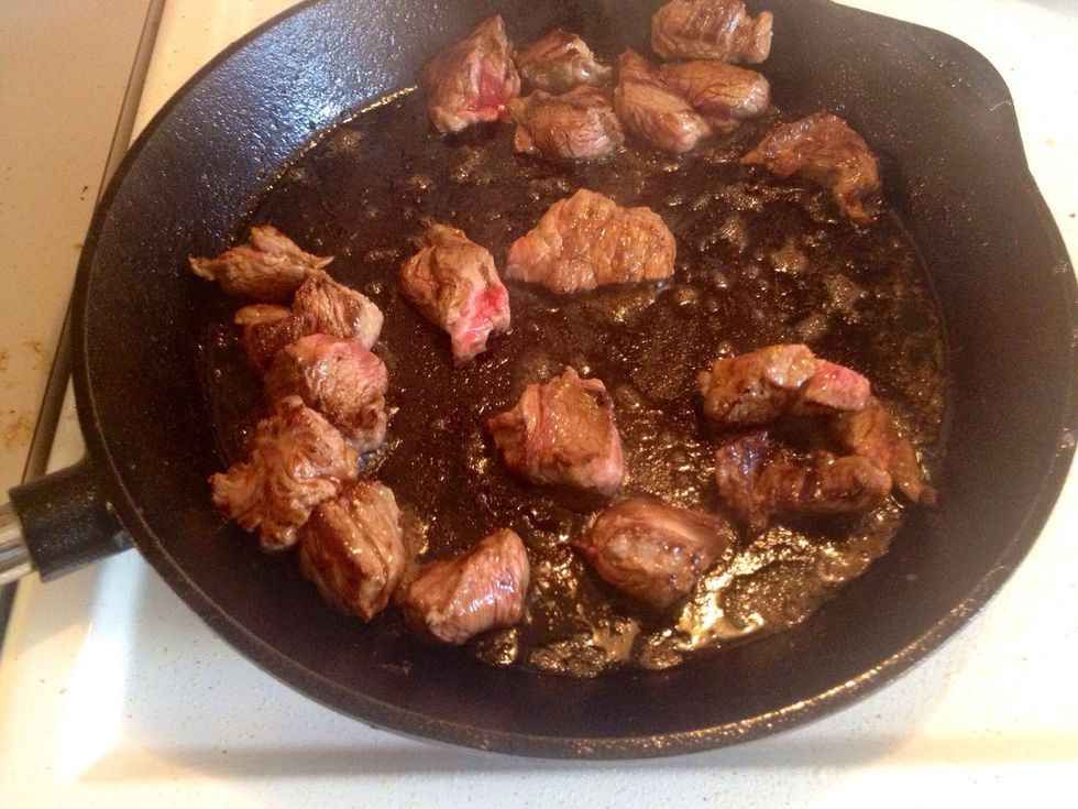 Pan-broil the meat in a hot pan. When the meat had got some color move it to a large pot. When all the meat is browned pour some water into the skillet and then add this to the meat.