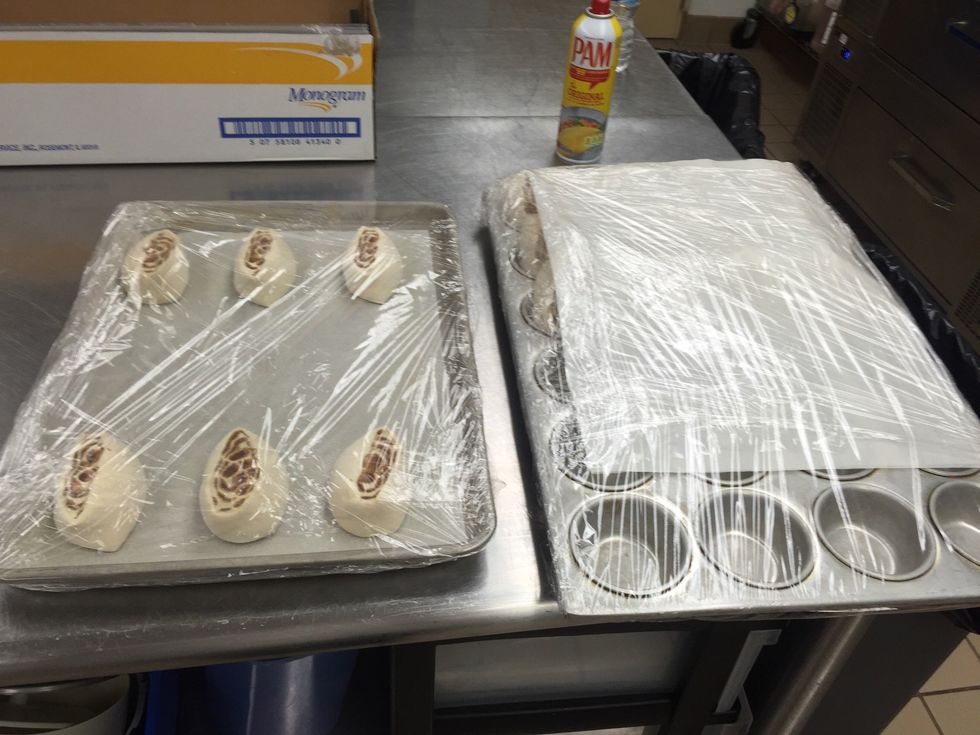 Pan cinnamon rolls into pans. Wrap and refrigerate to thaw (overnight).