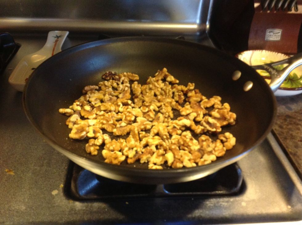 Pan toast walnuts, stirring often so they don't burn.