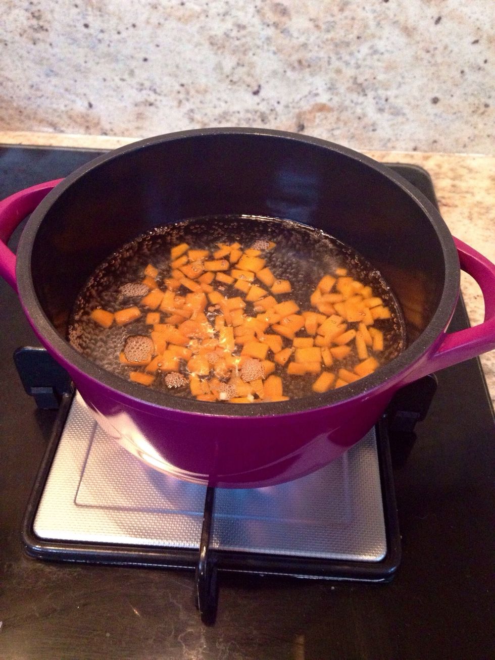 Par boil the diced carrots . Drain and keep aside
