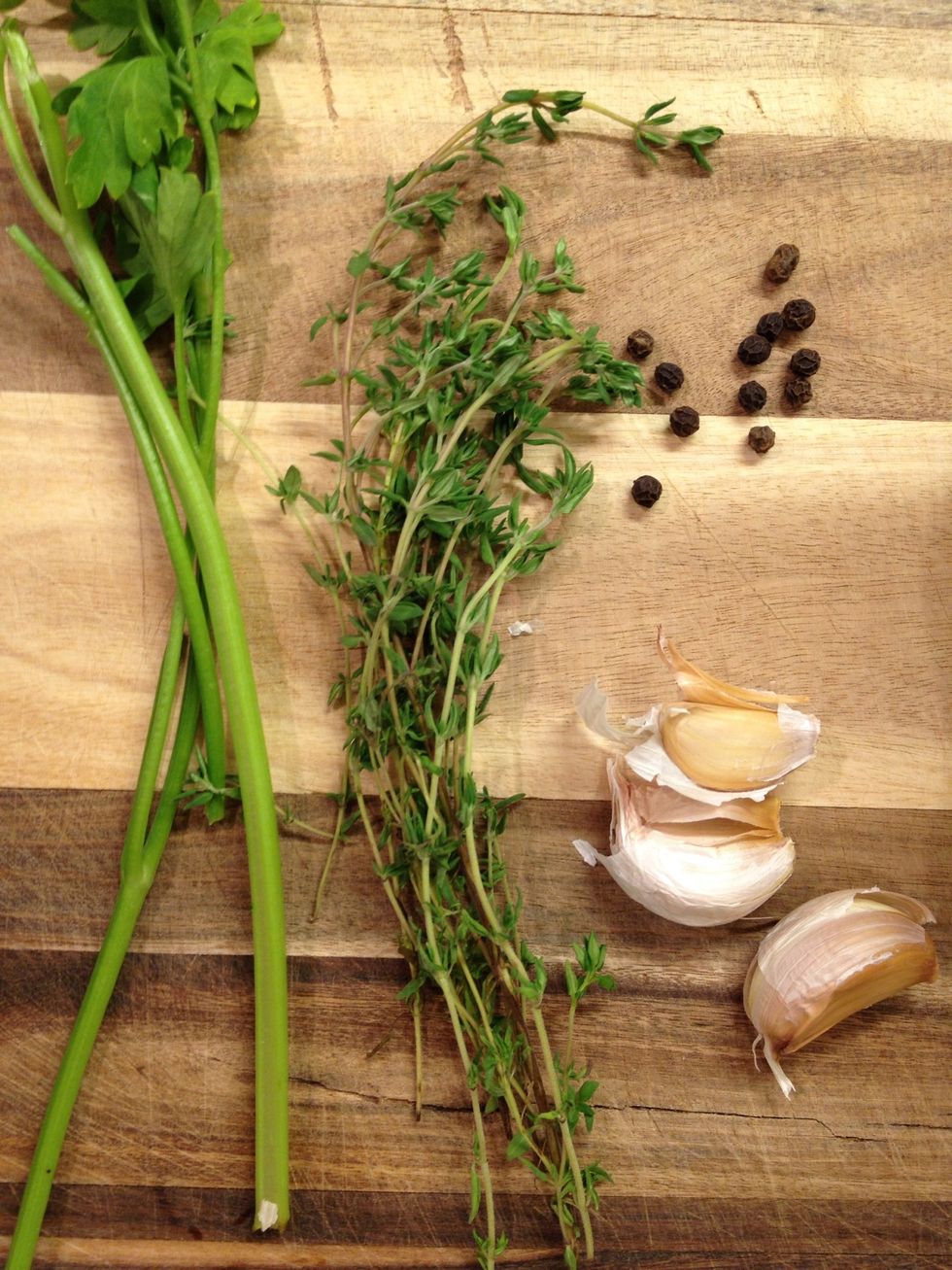 Parsley steams, thyme, garlic and black peppercorns.