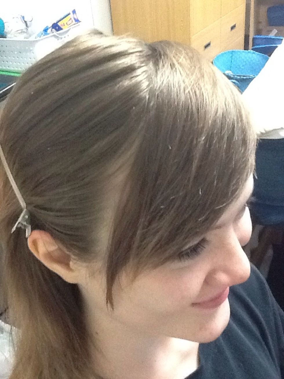 Part the bangs from the rest of the hair