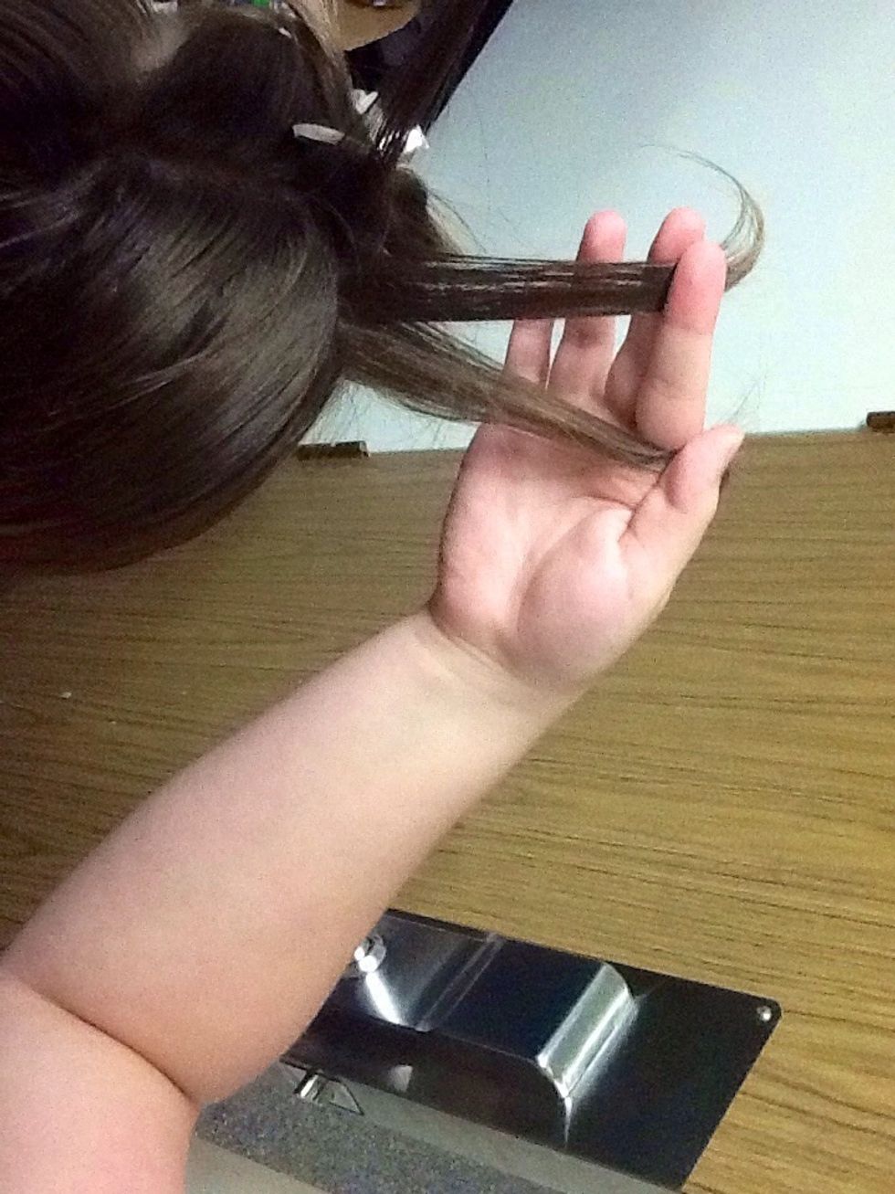 Part the hair at the top into 3 strands