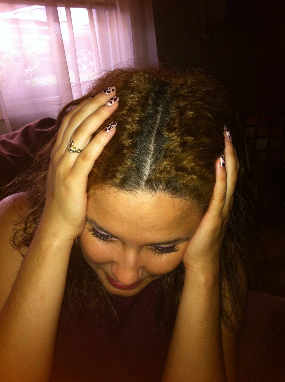 Part your hair according to where you want it once finished, just so you don't have to disturb your beautiful curls.