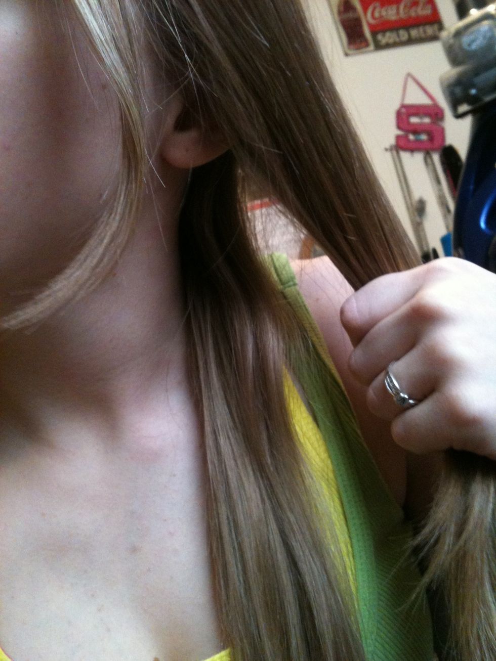 Part your hair and separate your hair into two sections. (that piece off to the side is part of my bangs, so it will get pinned back later)