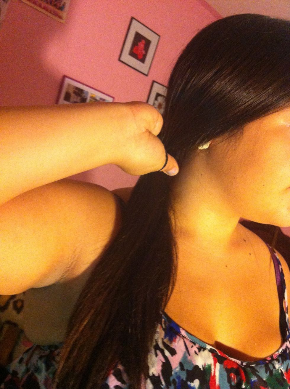 Part your hair to your preferred side