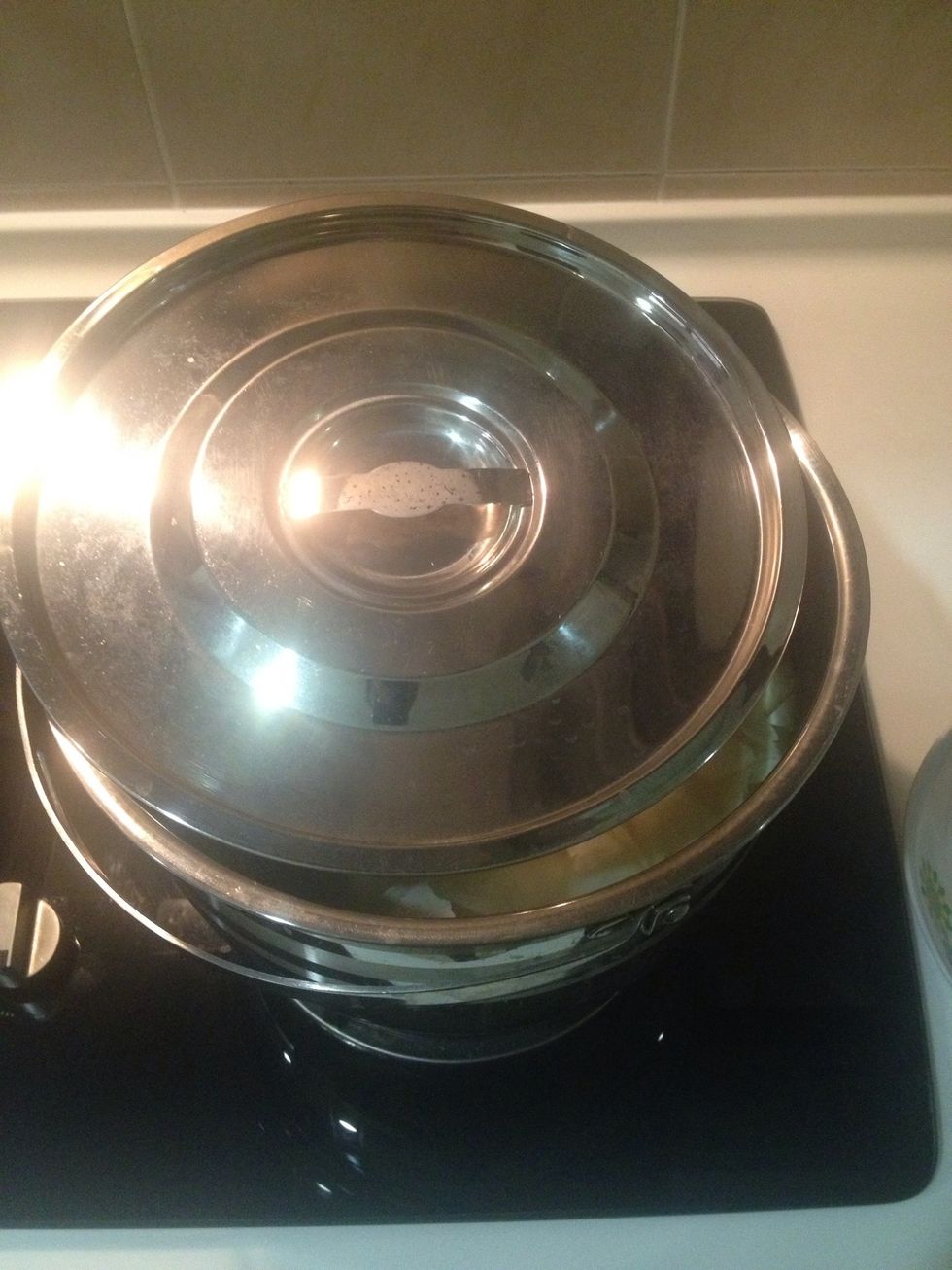 Partially cover the pot with lid. Don't cover entirely as it will spill. Let it cook for another 30 minutes.