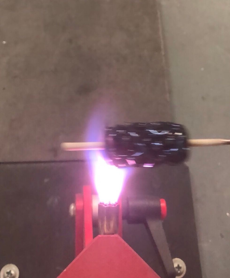 Pass the bead through the yellow candles a few times.