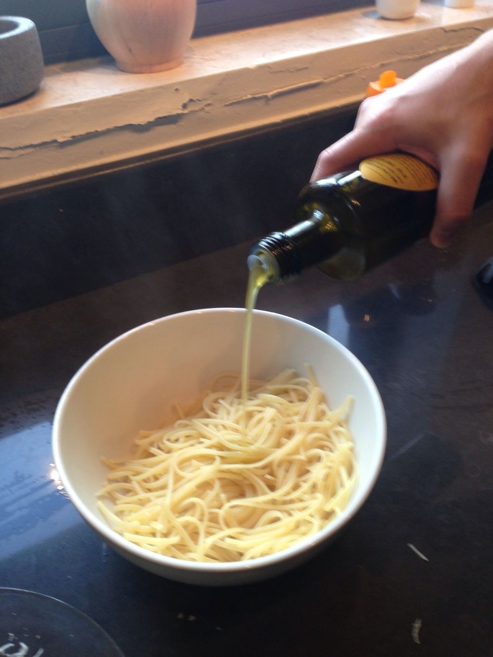 Pasta out, add olive oil so it won't stick