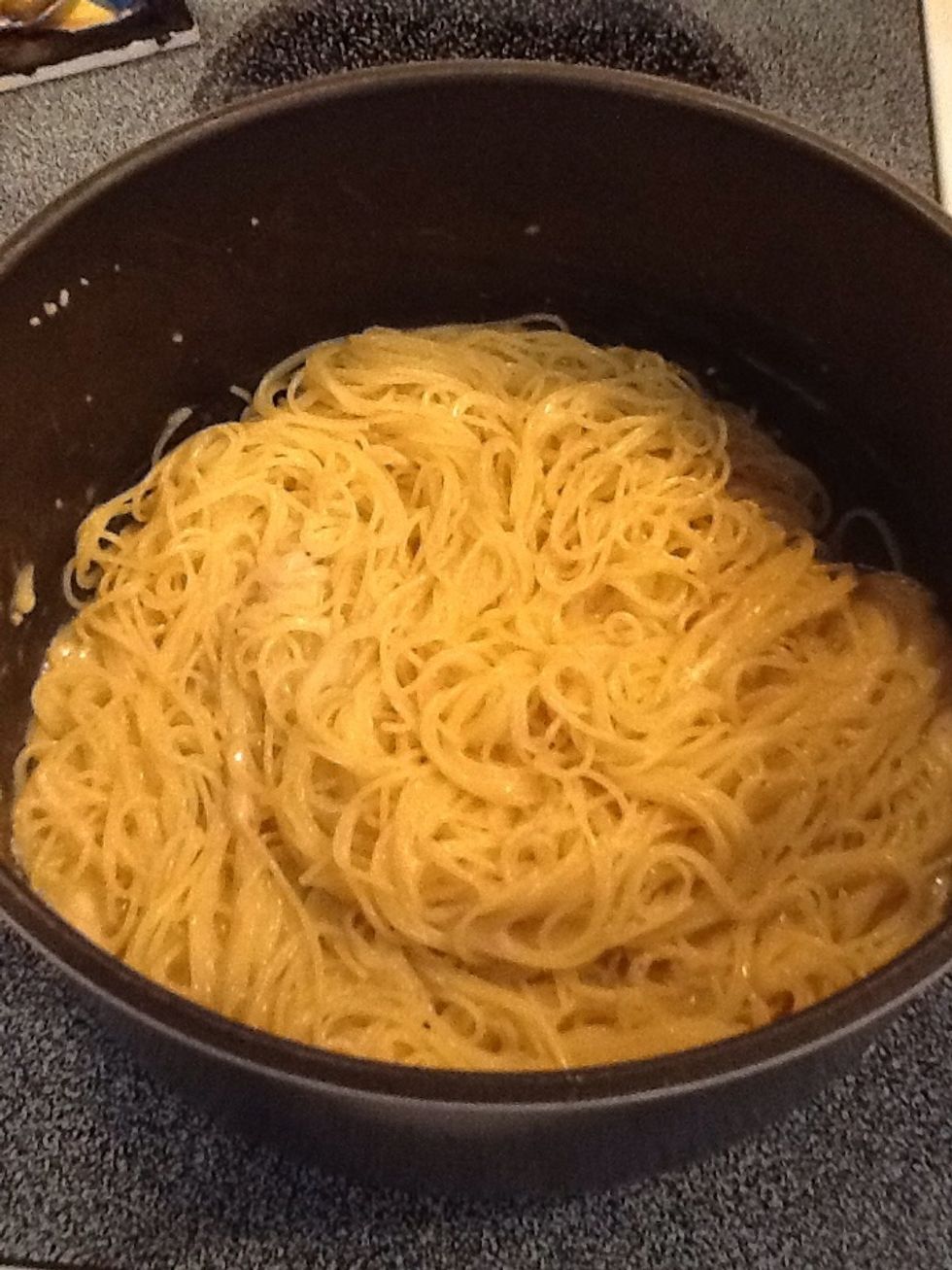 Pasta with melted Parmesan cheese looks like this.