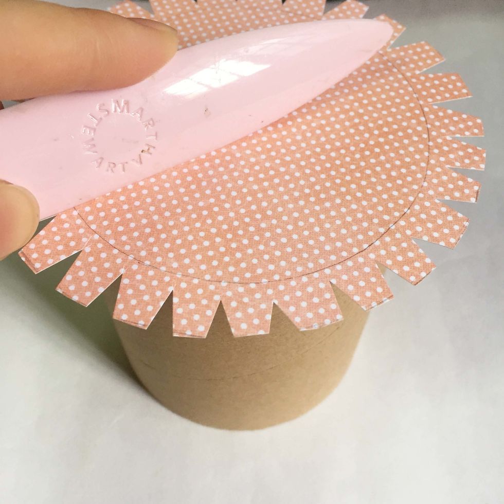 Paste the pattern paper over ensuring that it's in the centre of the base. Burnish it flat using a bone folder.