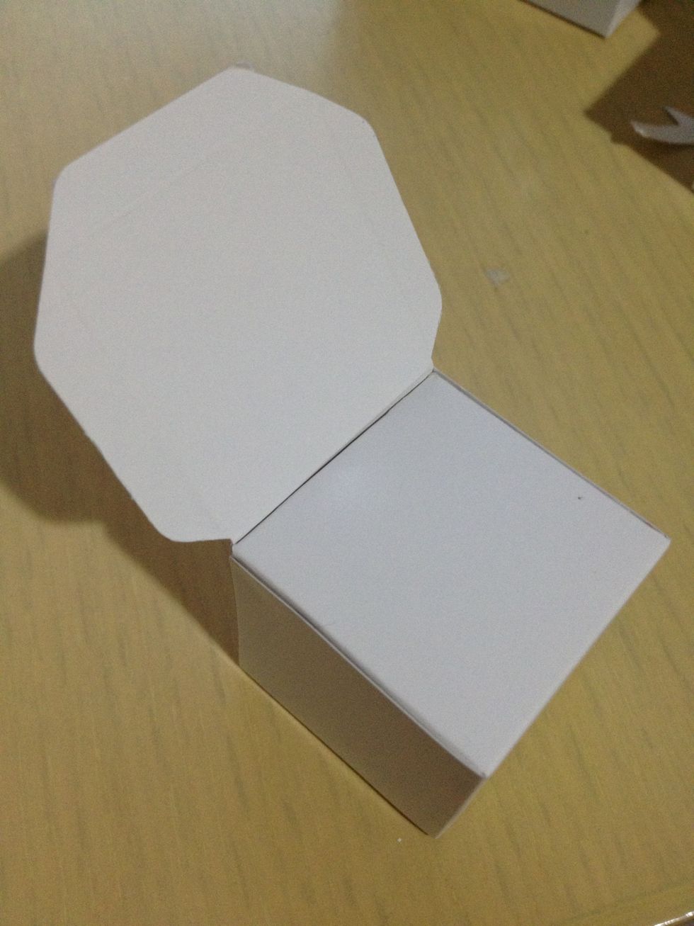 Paste this part onto one cube. This will be the ear of the dog. Repeat for another cube.