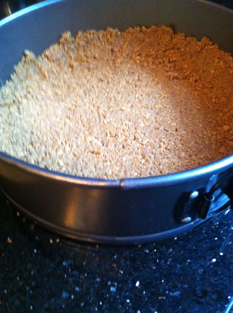 Pat down in pan. You can use the bottom of a glass.