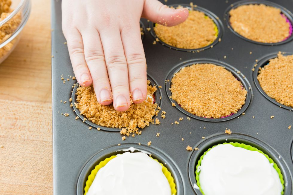 Pat down to ensure a flat layer of graham cracker topping. Freeze for about four hours, until set.