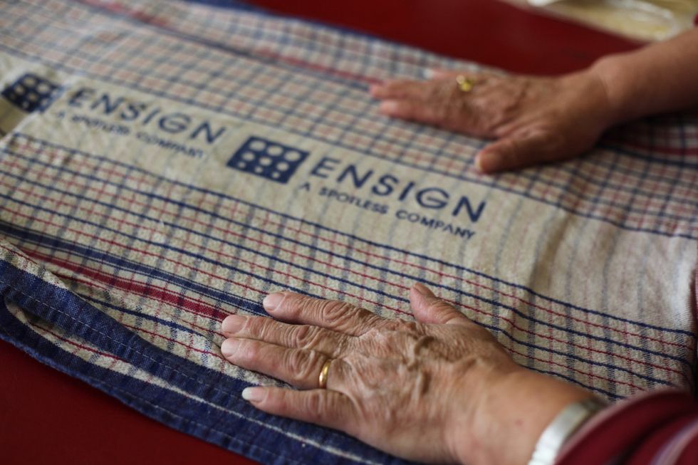 Pat the towel down with your hands or with your Mother's hands, if you're busy tasting the choc mix.