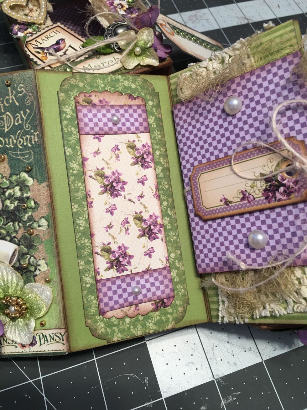 Pattern and decorate each page by using decorative punches, adding flat back pearls, bits of the lace and gauze and flowers. Check each time you add in decorations to make sure your box still closes.