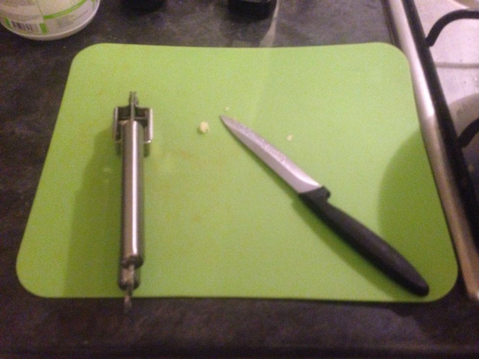 Peal the garlic and crush