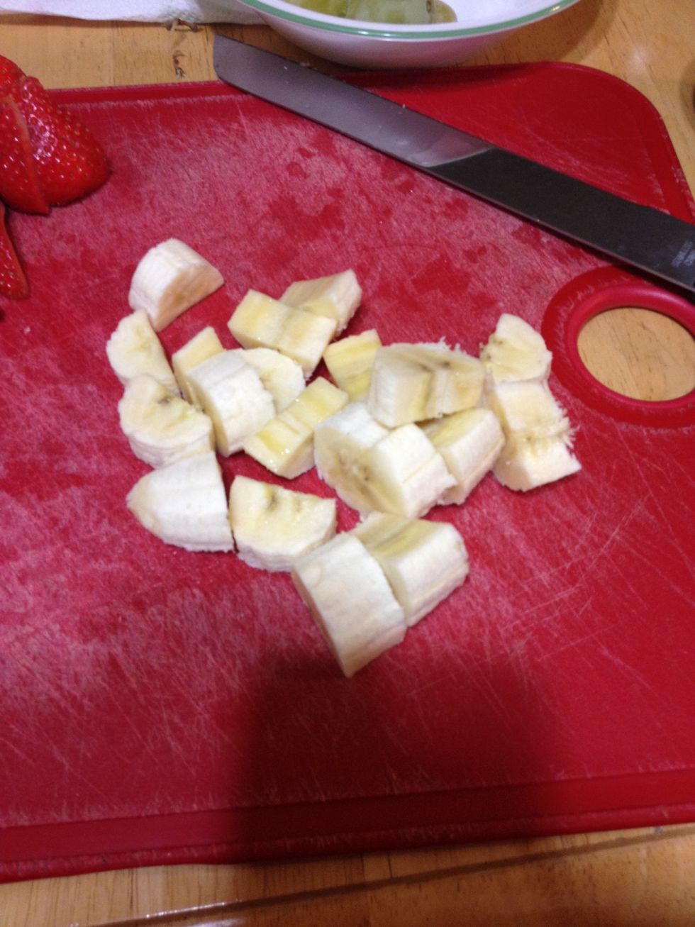 Peal your banana and cut down the middle, then cut into pieces like so.