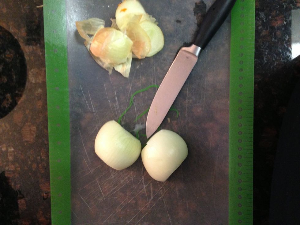 Peel 1 yellow onion. Do so by cutting off each end of onion & slice down the middle. Peel back outer skin.