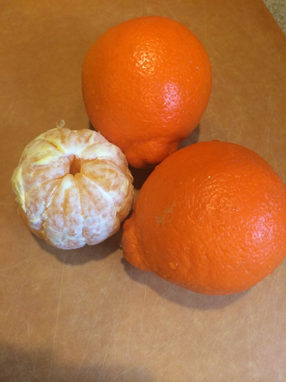 Peel 2 minneolas (cross between mandarin and grapefruit)