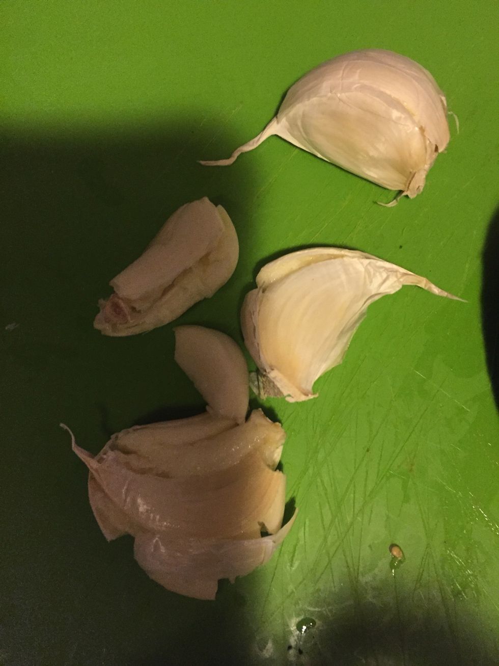 Peel 4 garlic cloves