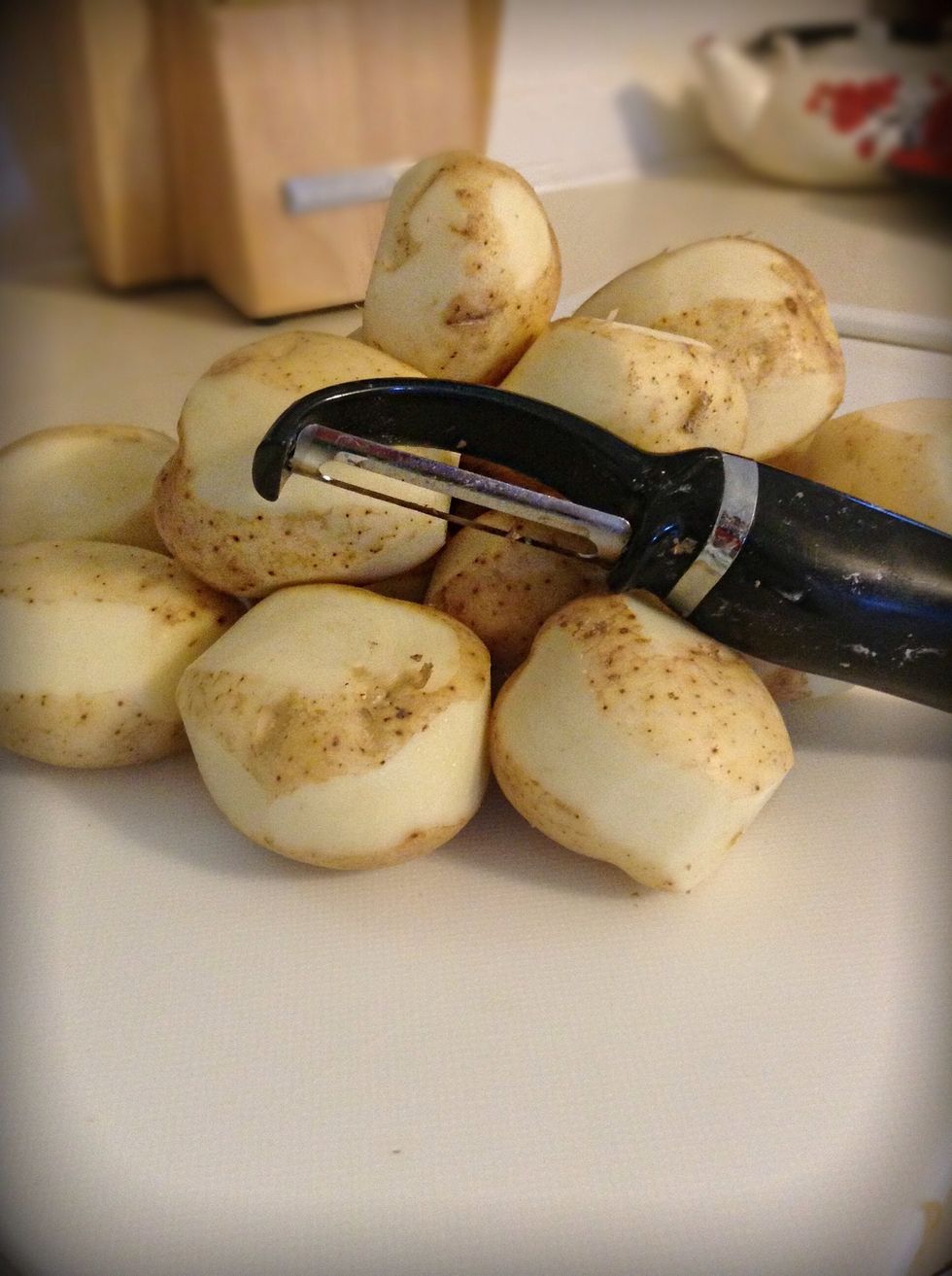 Peel a bit of your potatoes. I do stripes this is where it will crisp up once placed in your pan. Without peeling them just a little you won't get much of the crispy part when cooking them.