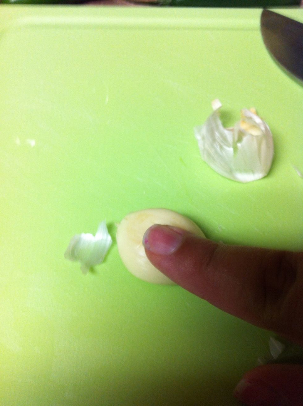 Peel a garlic clove or two and add to the pan. My clove was large so I only added one.