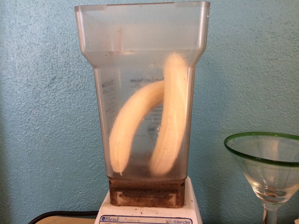 Peel and add the two bananas to your blender.