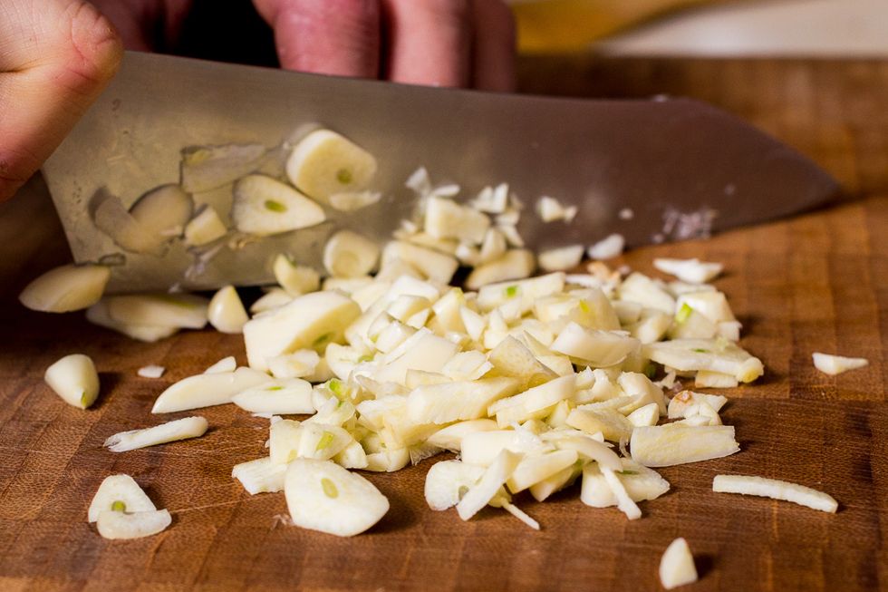 Peel and chop your garlic. Roughly chopped is fine as this dish will be simmering for quite a bit.