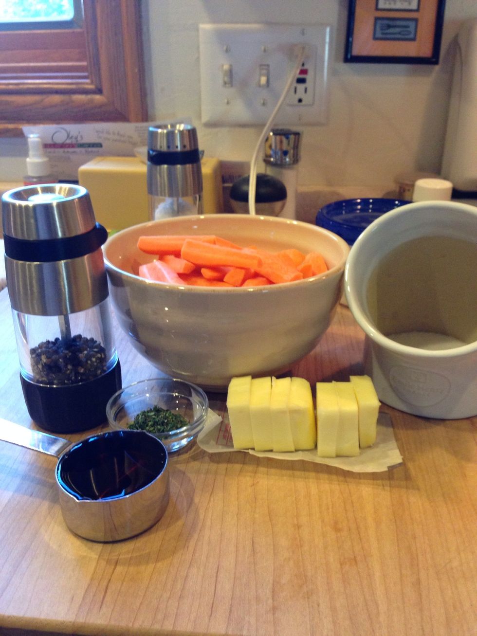 Peel and cut carrots into 2 inch lengths, quartering the large ends and halving the small ends