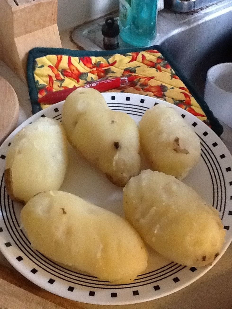 Peel and cut potatoes into cubes once they are medium soft