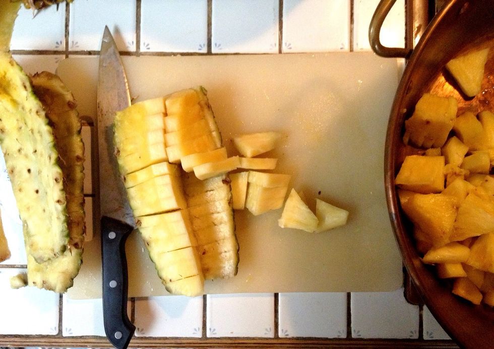Peel and cut the pineapple into small pieces.