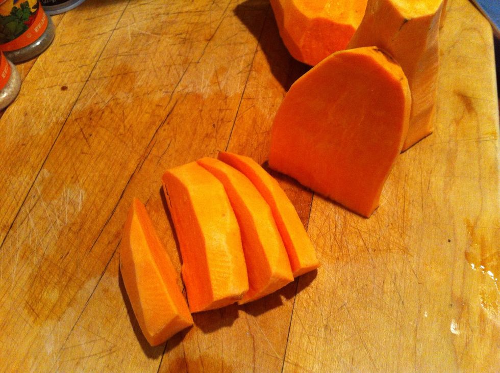 Peel and cut up washed sweet potatoes.