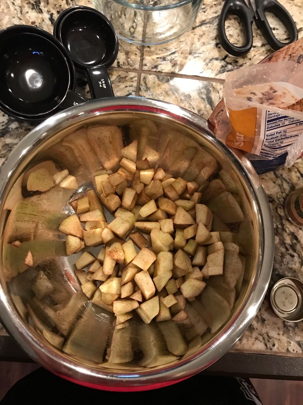 Peel and dice apples and mix with 1 tablespoon of cinnamon
