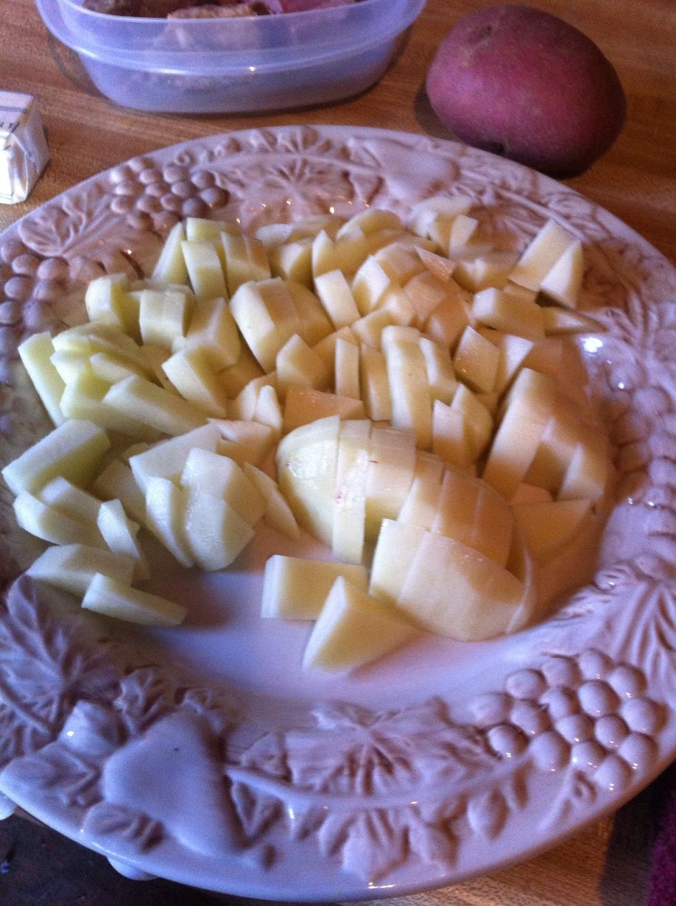 Peel and dice several potatoes