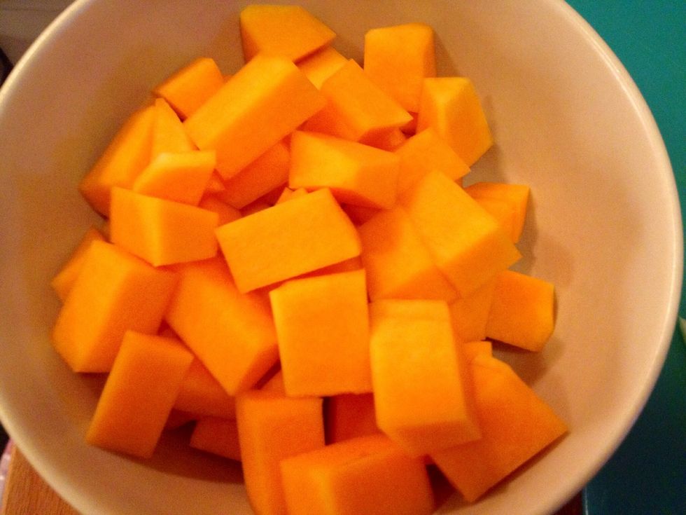 Peel and dice the butternut squash.