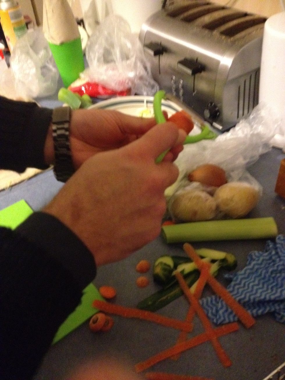 Peel and dice the carrots. My friend offered to cut the veggies for me. Explaining the man hands.