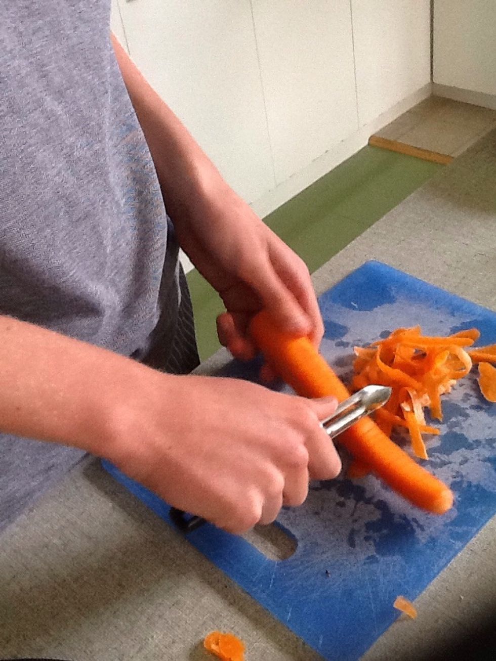 Peel and grate a carrot.