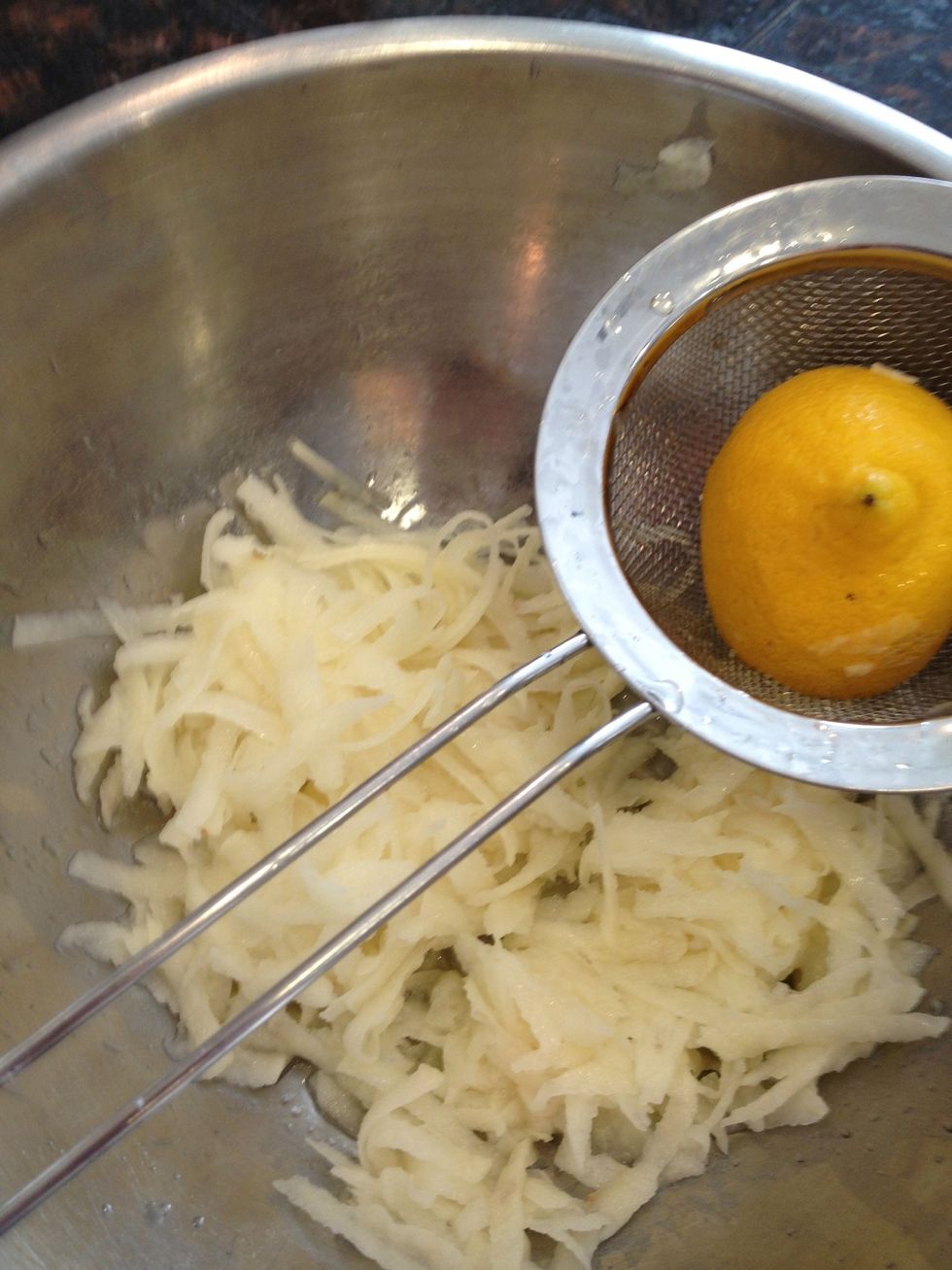 Peel and grate the sweet and Russet potatoes separately and squeeze some lemon in for flavor. Wrap in paper towel to squeeze out moisture and let dry.