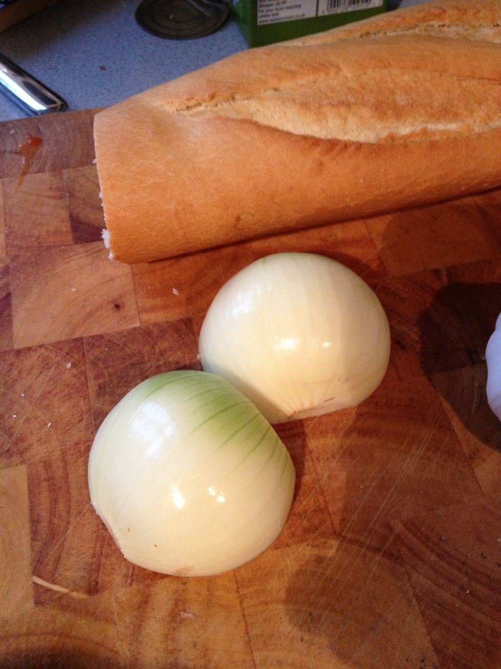 Peel and half onions