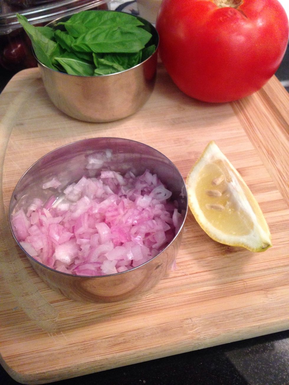 Peel and mince the shallot to give you 2 tablespoons of minced section keep the rest to fry - place in a bowl with the juice of three lemon wedges
